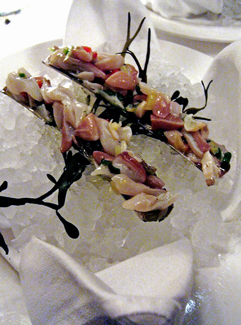 A squeeze of lemon "cooks" razor clams instantly at Esca. Photo: Steven Richter