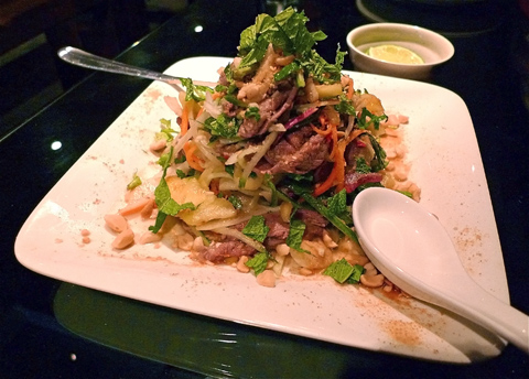 Thai beef salad is a hill of pineapple, mint and torrid red chili bits. Photo: Steven Richter