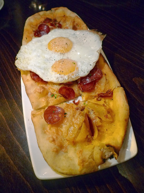 We smash the yolks and divide the flat bread as a warmup. Photo: Steven Richter