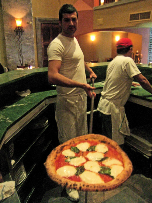 Riccardo, the charismatic pizzaiolo, also has time for flirtation. Photo: Steven Richter.