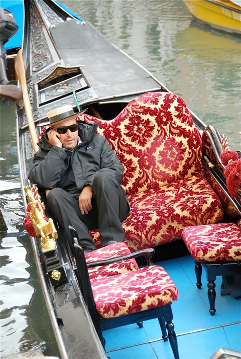 Gondolieri on his mobile phone