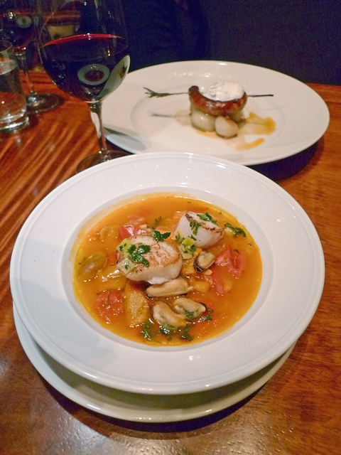 Seared scallops with peppers and mussels make a splendid starter. Photo: Steven Richter